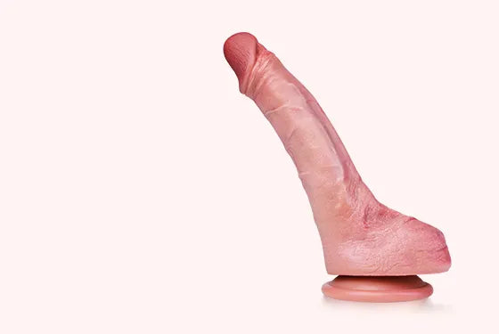 Jessie realistic dildo on a pale pink background
