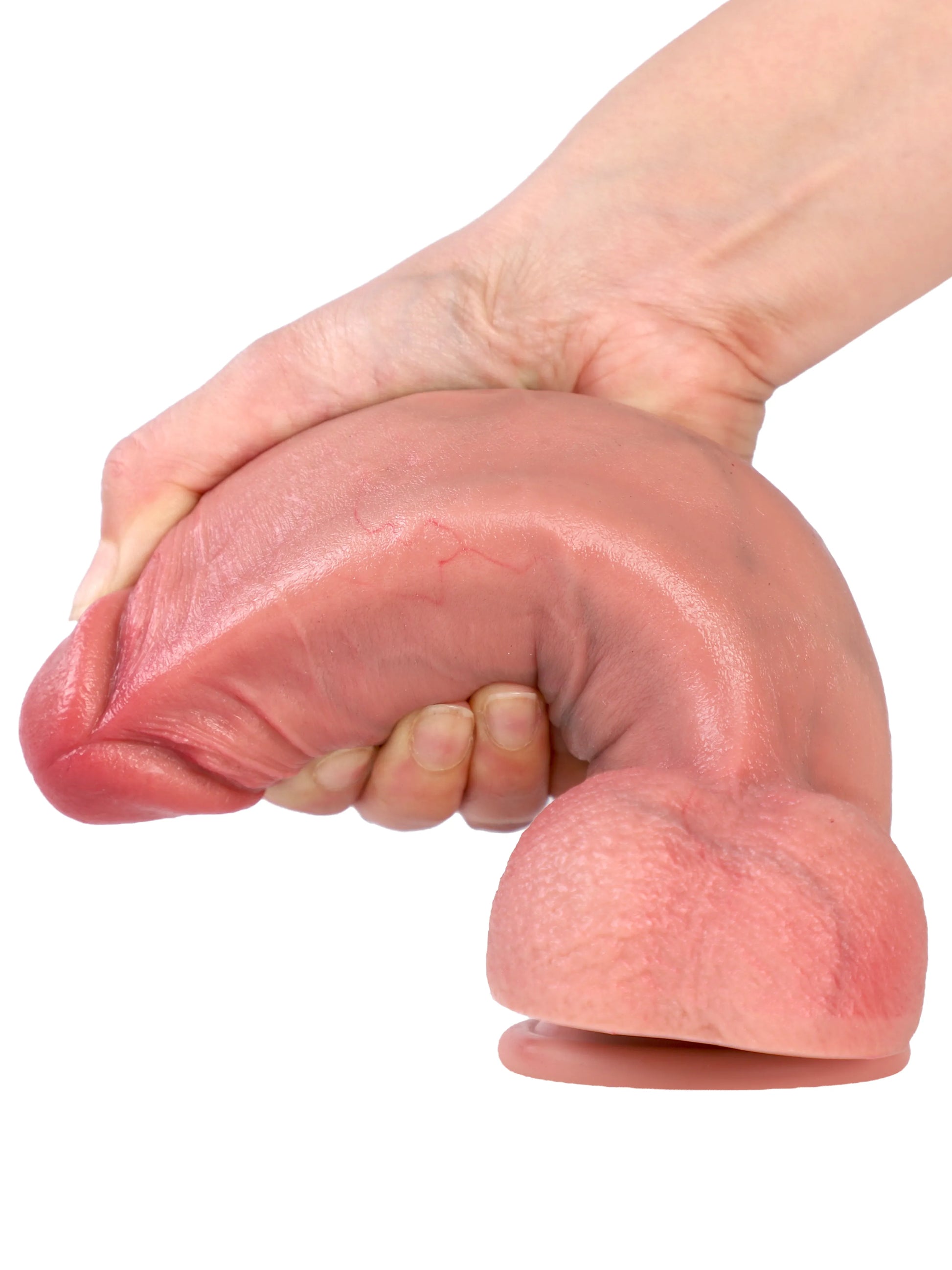 Hand bending Neil realistic dildo into a curved shape