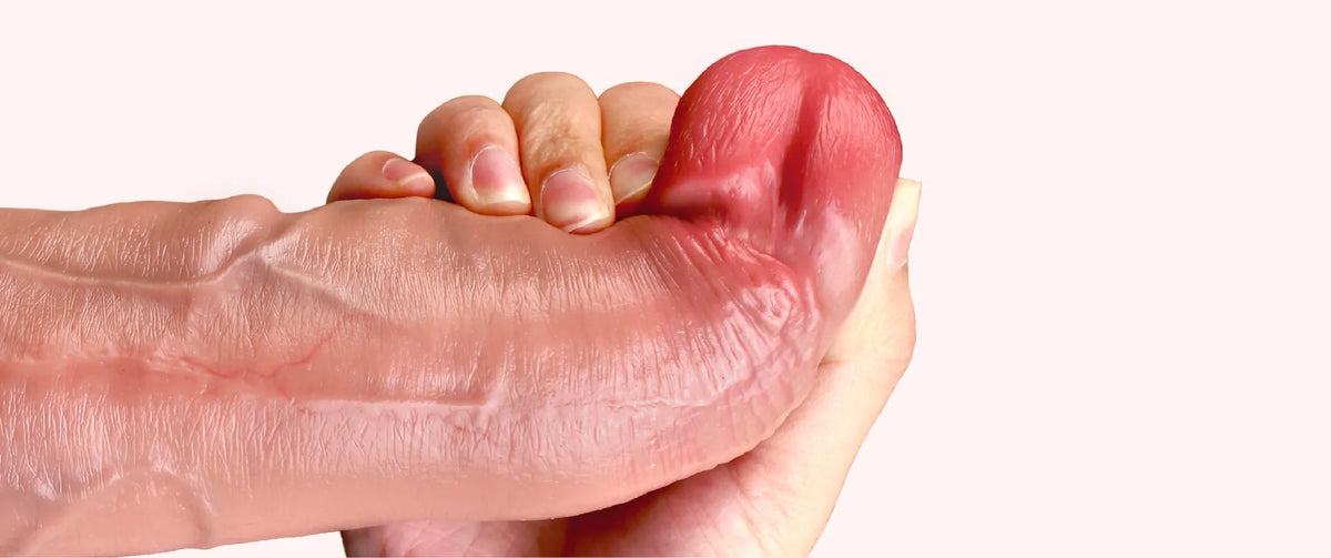Close-up of Geoduck Boy realistic dildo tip and textured surface