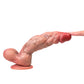 Finger pressing the tip of the Coach dildo
